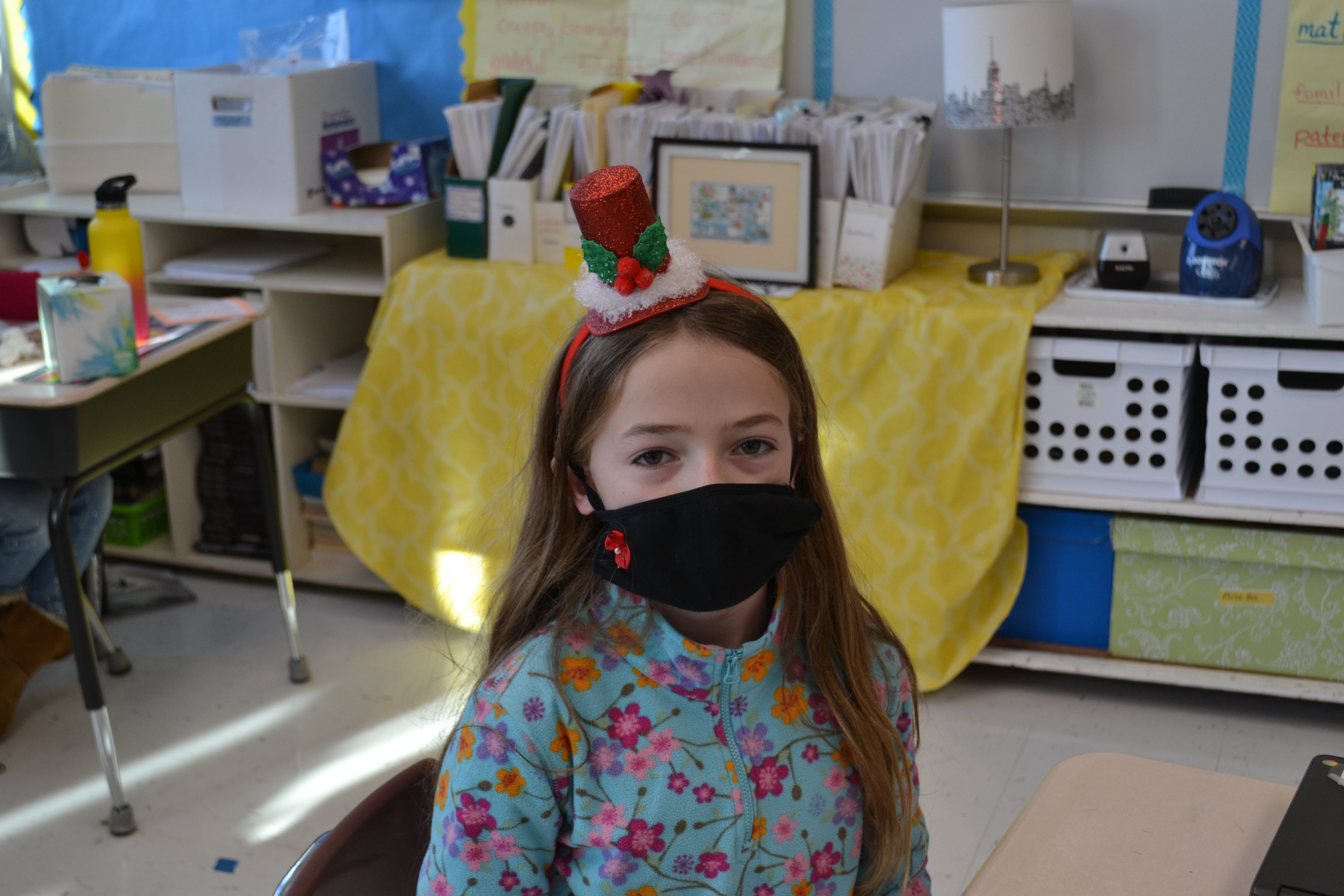 student with christmas headband