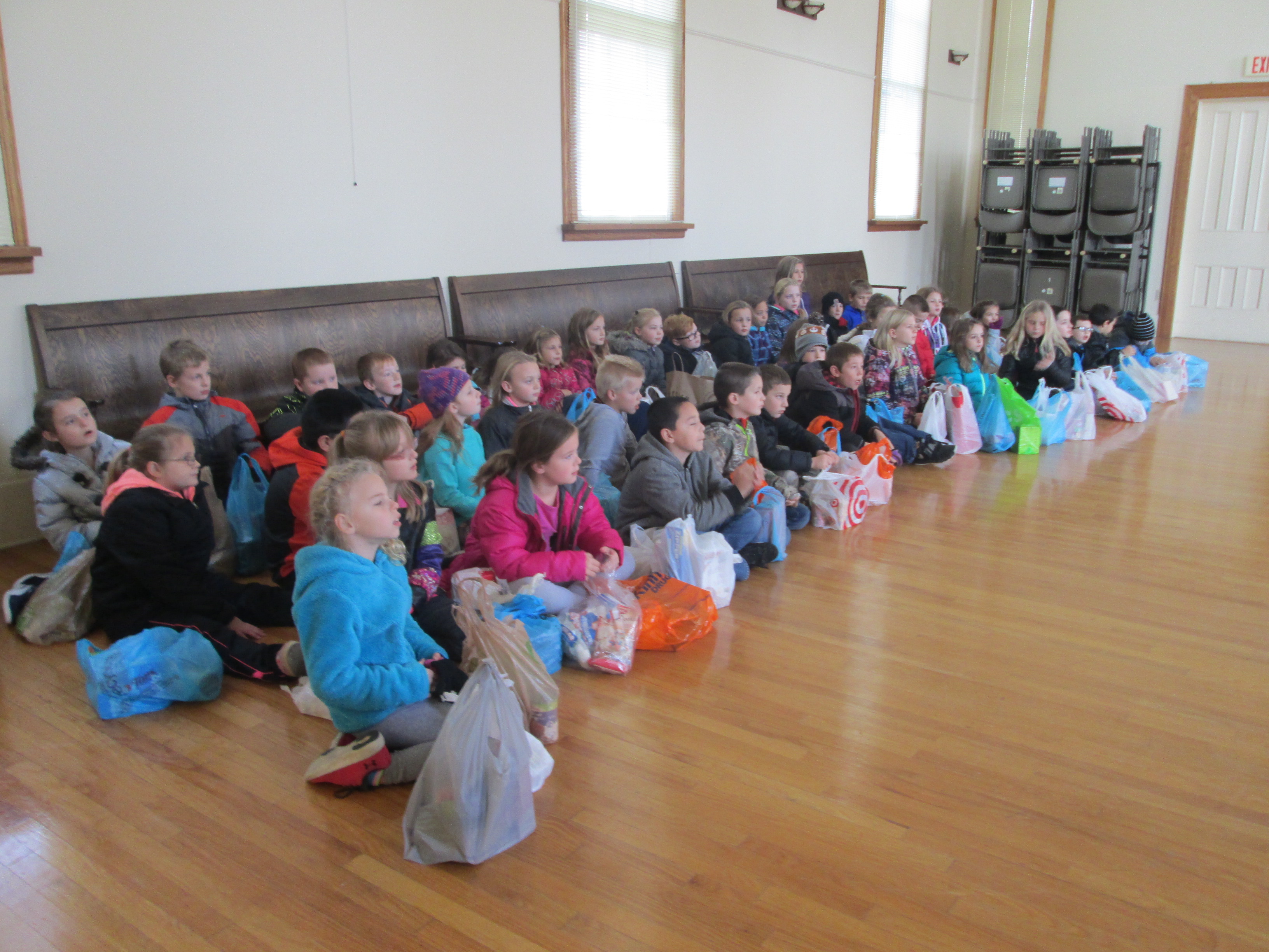 3rd grade students listening to presentation