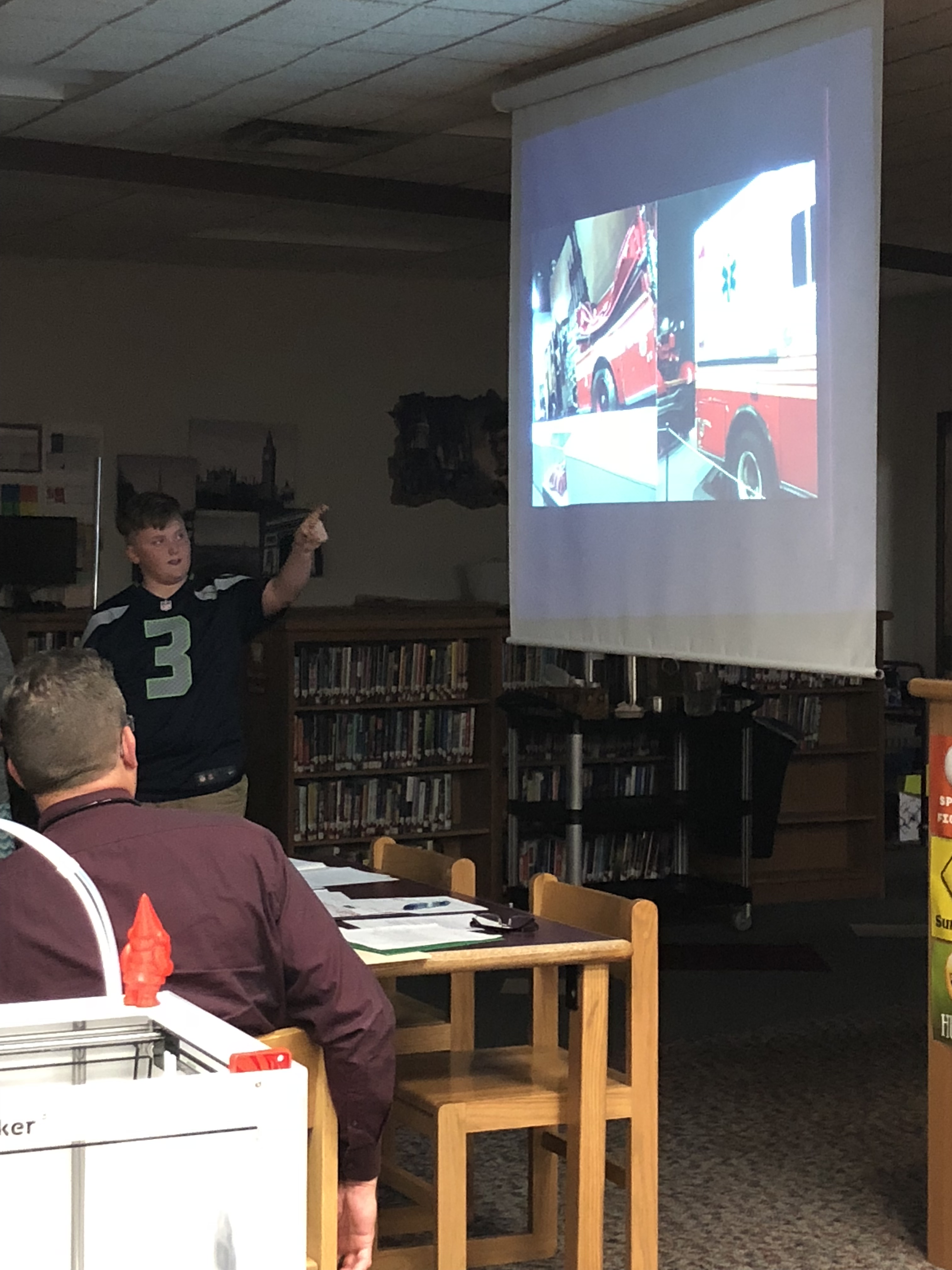 student presents about the museum the class visited in Albany