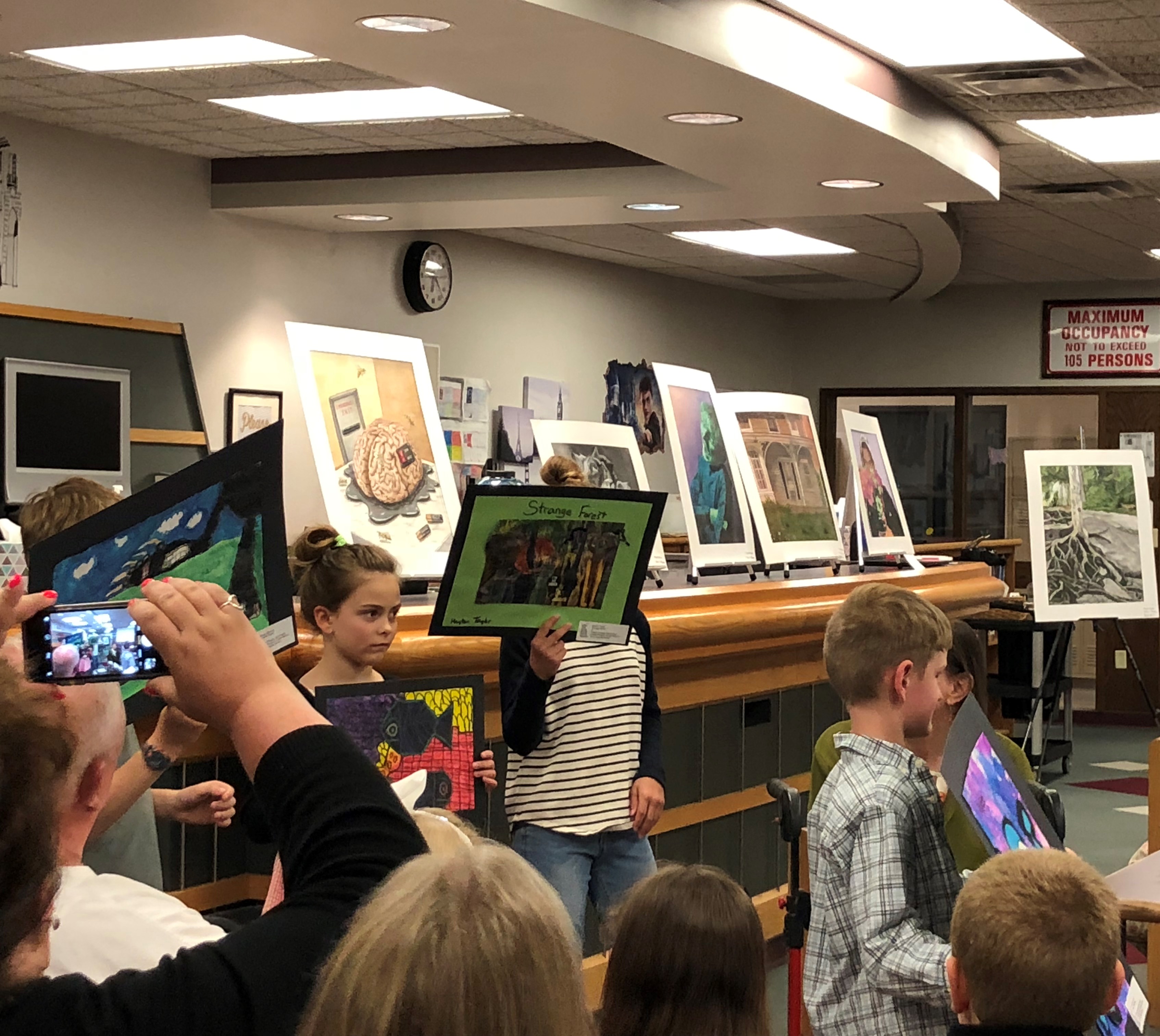 ES students showing their artwork