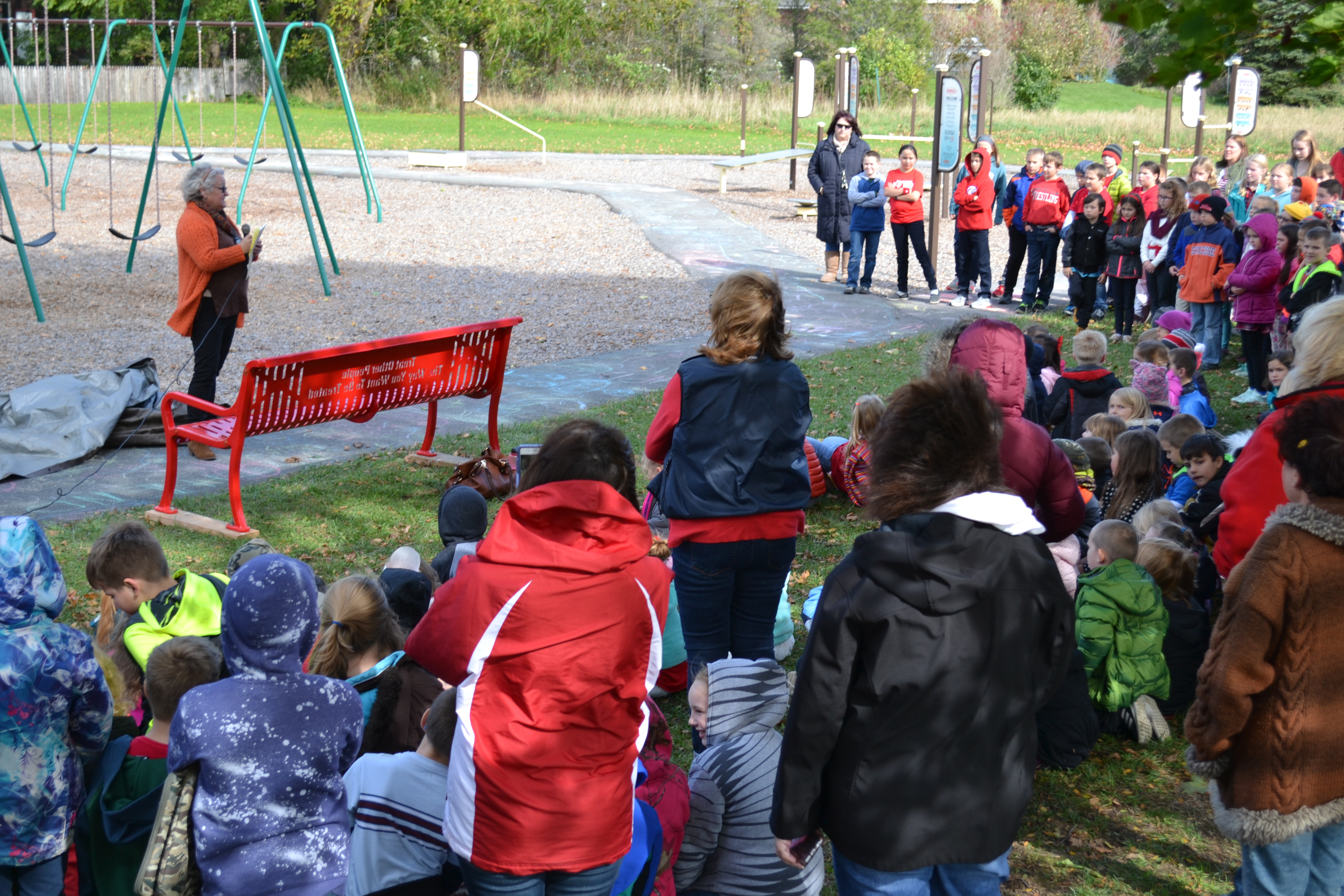 Mrs. Murray presenting the buddy bench