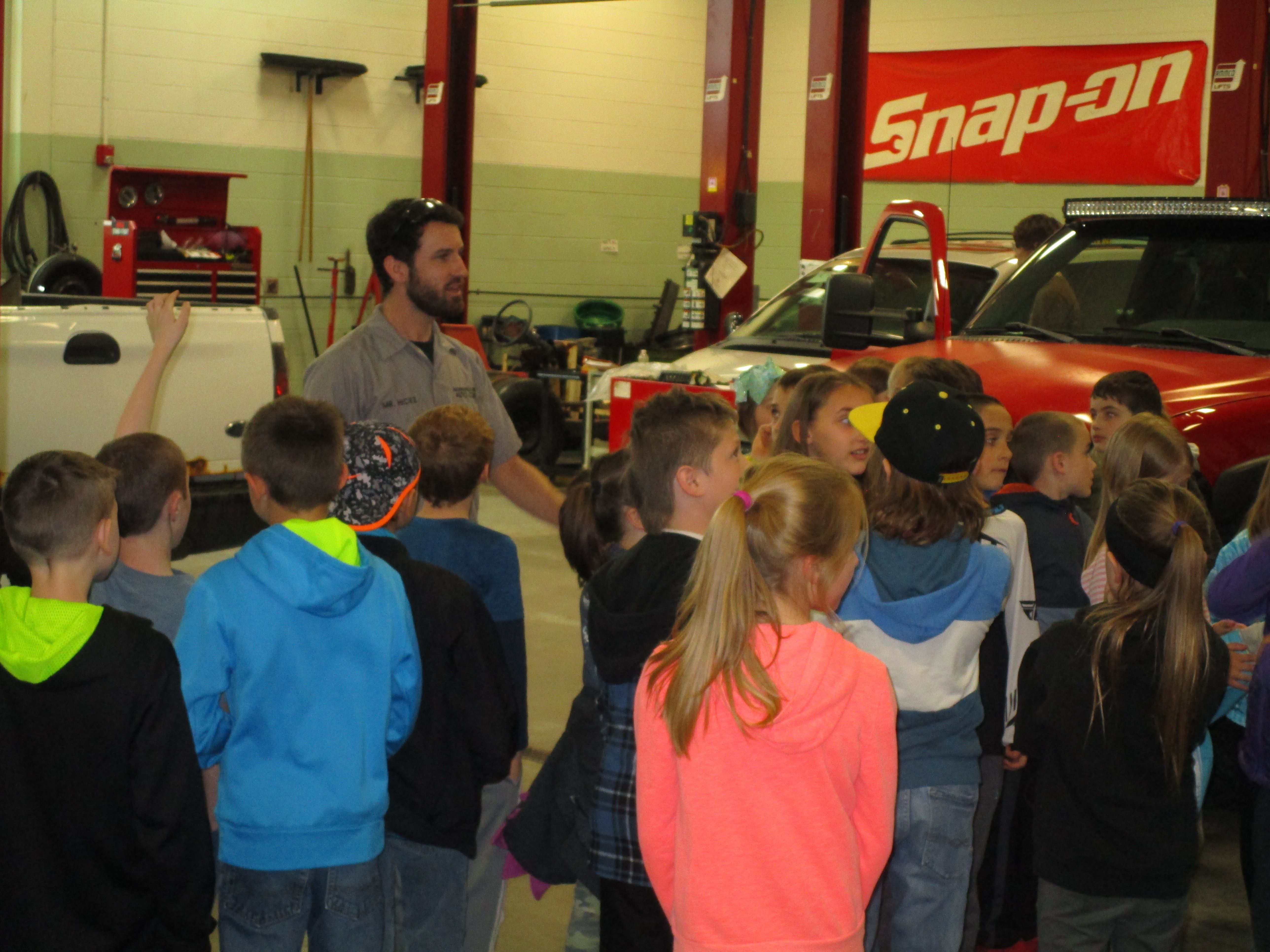 students in automotive garage