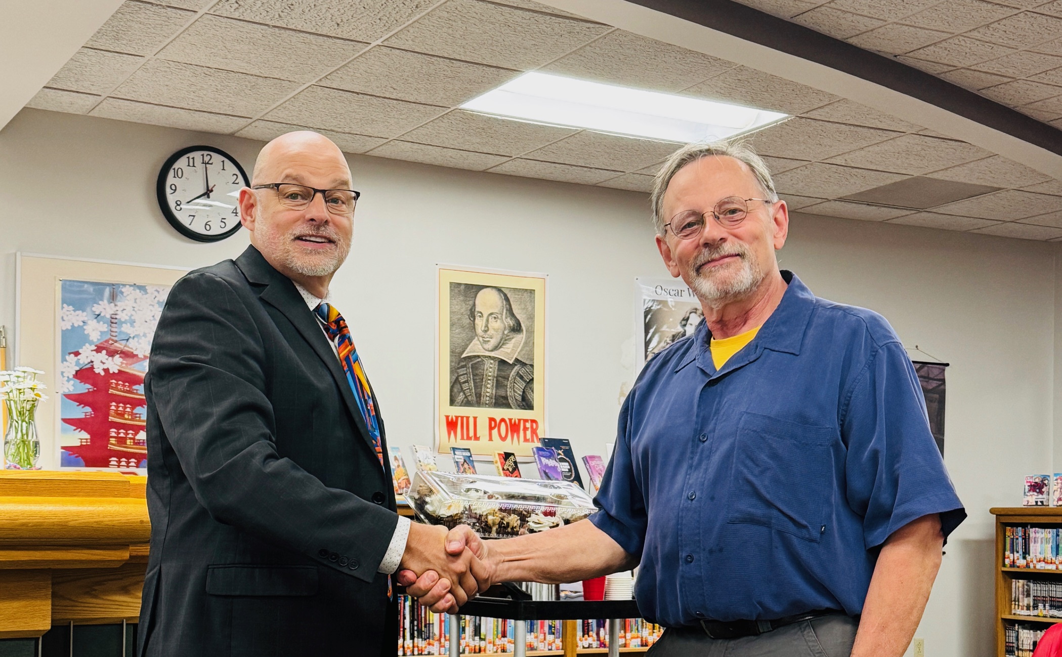 John Repak shaking hands with superintendent